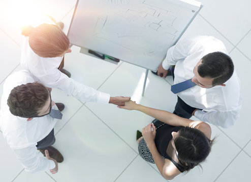 view from the top. the background image of a business handshake colleagues
