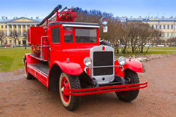 Retro car. Fire team of the last century. The car of firefighters. Red retro car.
