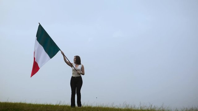 Patriot french woman running with flag of France