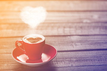 Cup of coffee with ehart shape steam