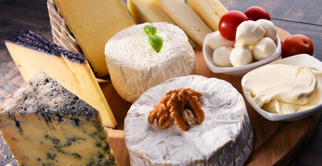 Different sorts of cheese on kitchen table