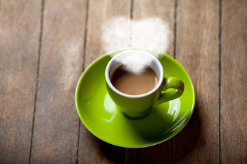 Cup of coffee with ehart shape steam