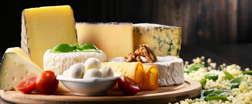 Different sorts of cheese on kitchen table