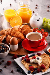 Breakfast served with coffee, juice, croissants and fruits