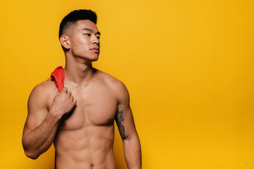 Fototapeta premium Portrait of young asian boy with fitness body.