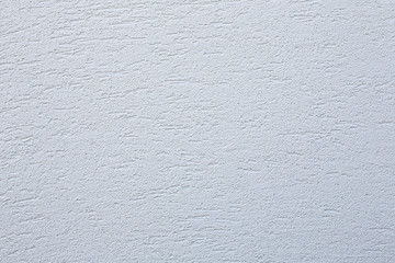 Facade plaster background. Single-ply monolithic plaster decorative background. Single layer scraped cement plaster wallpaper. Exterior building structure backdrop. Silica  sand cement wall plaster.