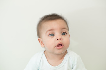 Blue-eyed baby boy on white background - Isolated background