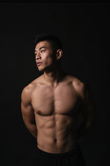 Fototapeta premium Portrait of young asian boy with fitness body.