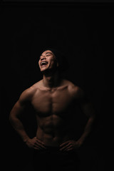 Obraz na płótnie Canvas Portrait of young asian boy with fitness body.