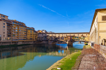 Arno river, houses and old Ponte Vecchio bridge, Florence, Tuscany, Italy