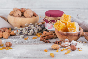 Ingredients for cooking bread or cookies: honeycomb, flour, raisines, mix of nuts, spices