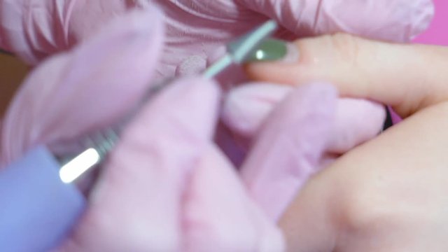 Slow motion. hardware manicure. removal of nail polish with a rotating nail file. HD