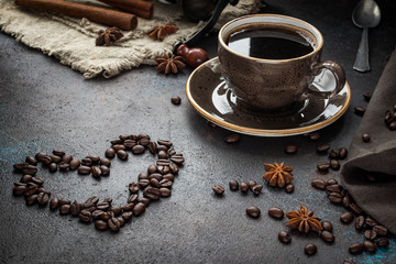 a Cup of coffee and a heart of coffee beans