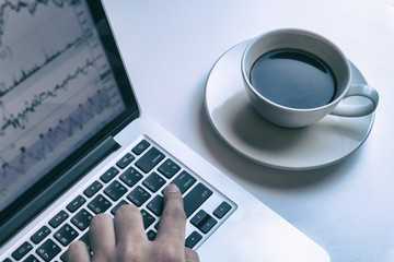 Business Man using Computer Laptop ,Tablet PC and Mobile phone in  Coffee Cafe Concept