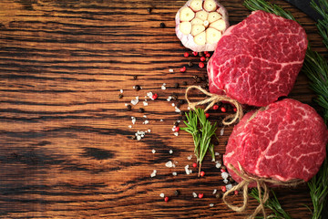 two raw fillet Mignon steaks