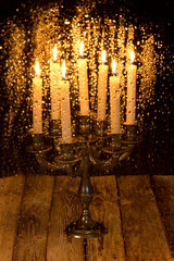 Obraz premium Water drops on the glass blurred on the background of a burning candle