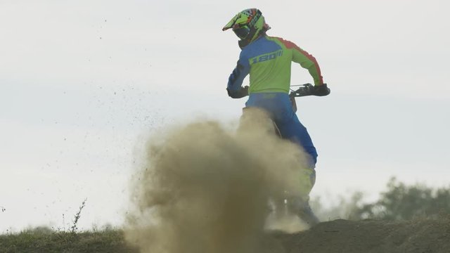 Motocross driver leaving dust behind