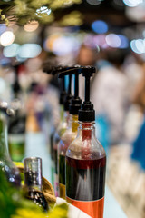 Row of pump head bottle of beverage in the cafe.