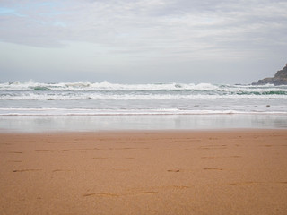 Atlantic Ocean surf in a cloudy day