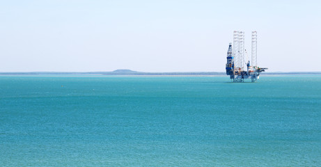 an off shore platform in the clear ocean