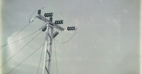 power line with electrical pole in the clear sky