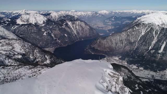 Epic aerial flight over mountain and beautiful lake, Hallstatt