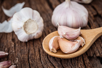 Close up group of garlic on kitchen wooden table