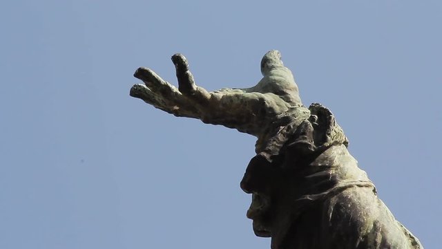 Statue Hand against Blue Sky.