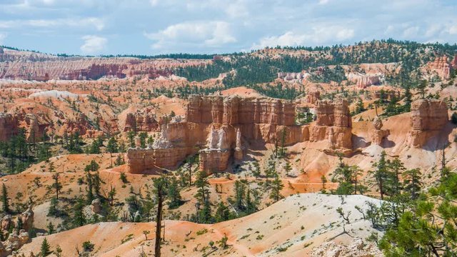 People walking along the trail. Sunny day in the Bryce Canyon National Park. Nature video. Amazing mountain landscape. Spectacular view at the cliffs. Nature video. Utah. USA. 4K, high bit rate, UHD