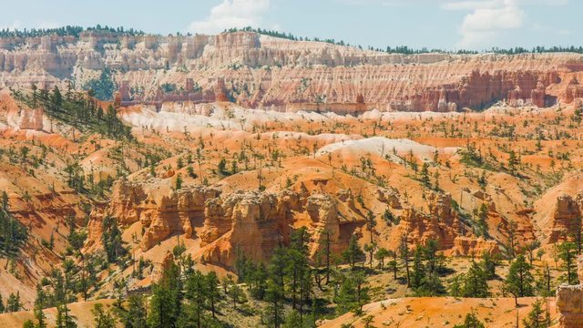 People walking along the trail. Sunny day in the Bryce Canyon National Park. Nature video. Amazing mountain landscape. Spectacular view at the cliffs. Nature video. Utah. USA. 4K, high bit rate, UHD