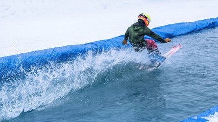 People are having fun doing pond skim