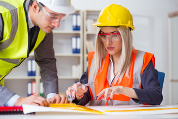 Construction workers having discussion in office before starting