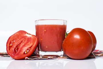 Fresh tomato juice isolated on white background