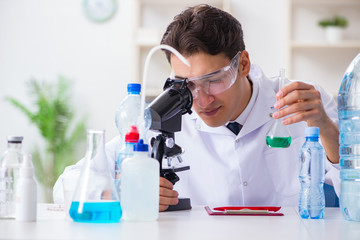 Lab assistant testing water quality