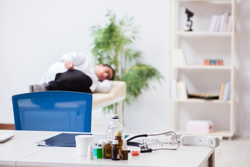 Doctor relaxing after complex surgery in hospital