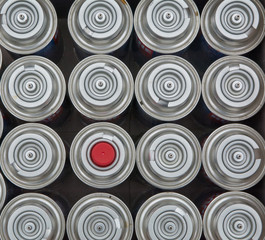Some of aerosol tins with one that have red cap