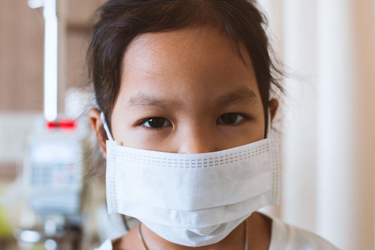 Sick Asian Little Child Girl Wear Protection Mask While Live In The Hospital