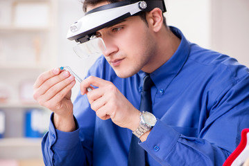 Jeweler working with luxury jewelry in the workshop