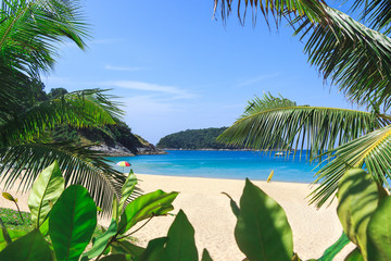 Picturesque view of Andaman sea in Phuket island, Thailand. Seascape with white sand, cliff, palm...