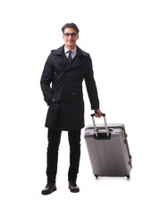 Young businessman with suitcase ready for business trip on white