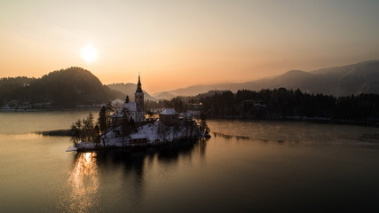 Naklejka premium Aerial photo of beautiful Bled lake landmark with church on the island at sunrise