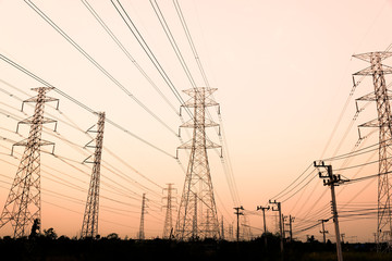 silhouette high voltage pole on sky sunset background.
