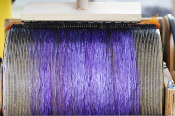 Felting wool. Combing the wool of alpaca or llama before felting on a special machine with a drum...