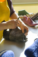 Handmade shoes. The process of making fashionable and stylish shoes from natural felted wool.
