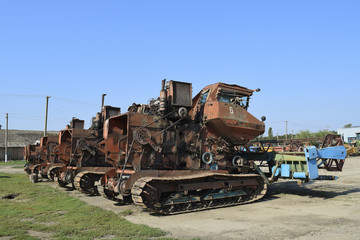 Fototapeta na wymiar Old rusty disassembled combine harvester.