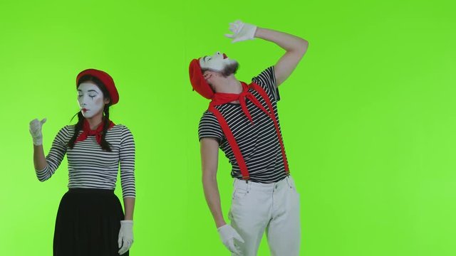 Drunk mimes drink alcohol on a green background