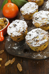 Mandarin muffins with raisins on the table