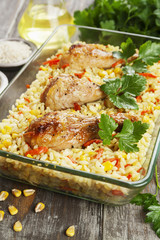 Chicken legs baked with rice and vegetables