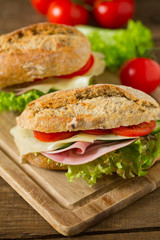 Wholegrain Ciabatta Sandwich with Lettuce, Tomatoes, Ham and Cheese