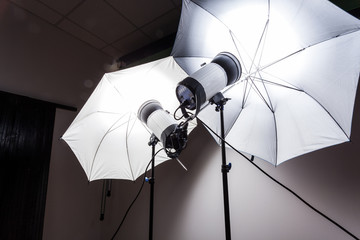Close-up 2 studio flash in gray in the photo studio.  Studio light for photography